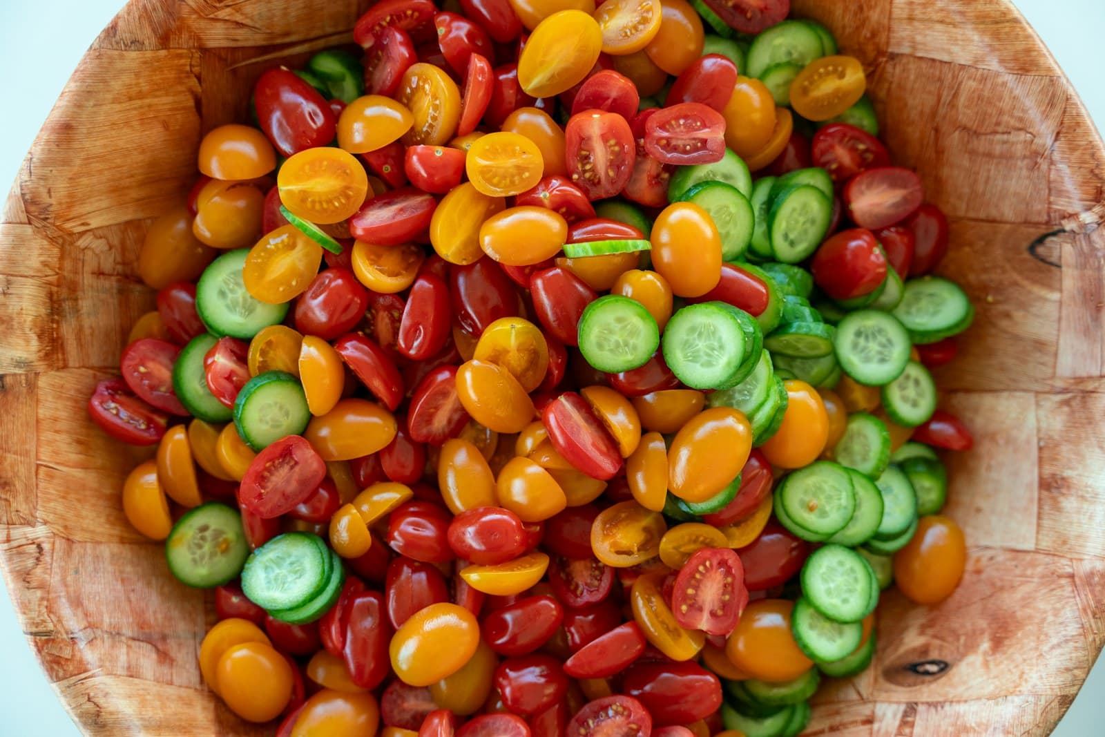 Photo of tomatoes and cucumbers in a bowl